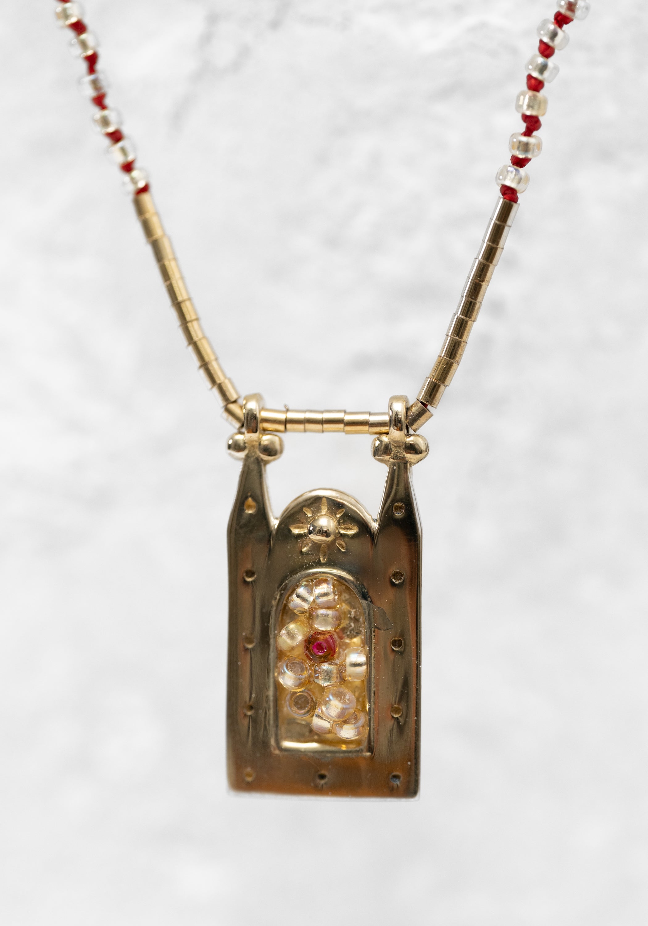 Brass Phoenix Bead Filled Frame Necklace