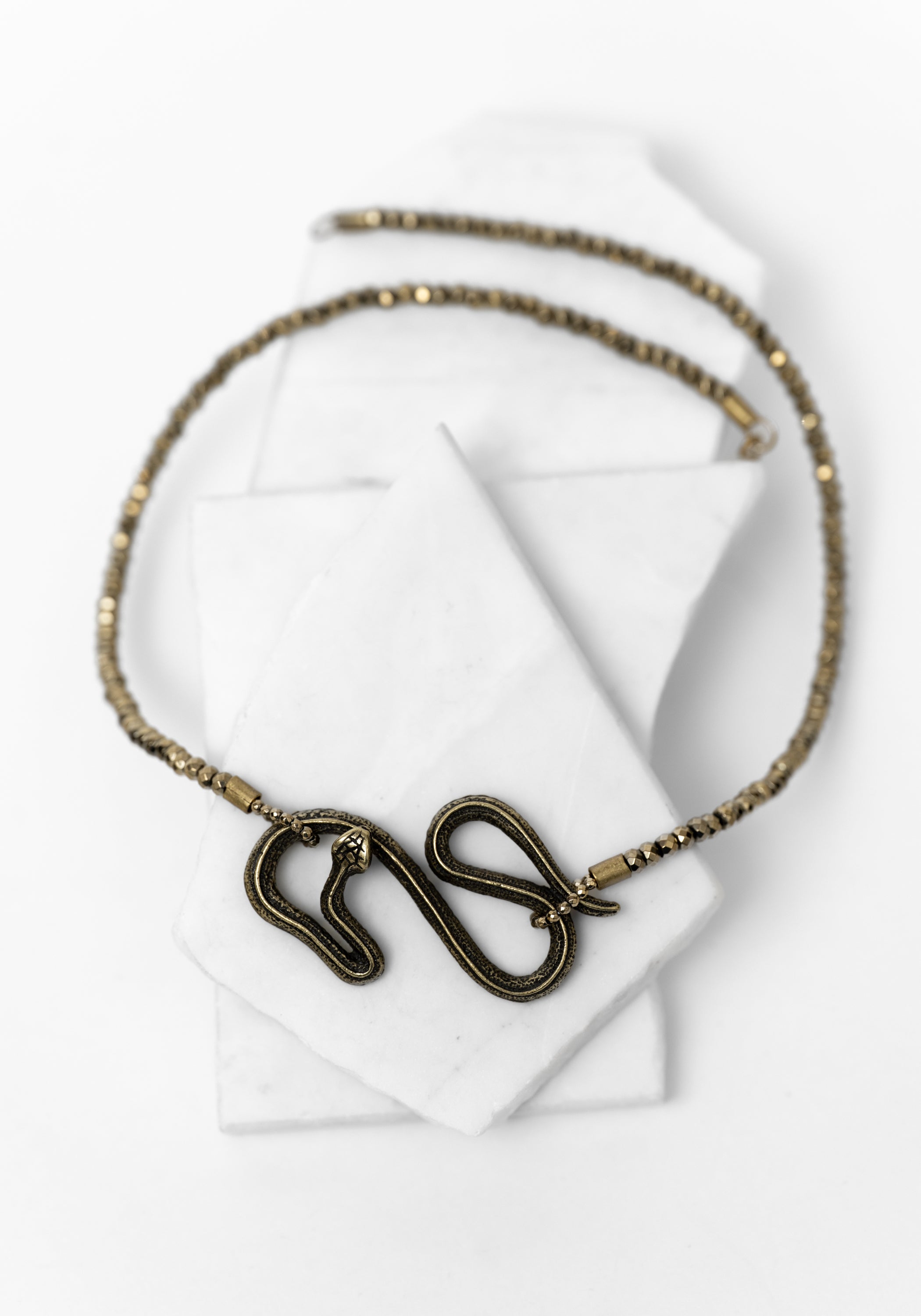 Hematite and Brass Snake Necklace - December Thieves