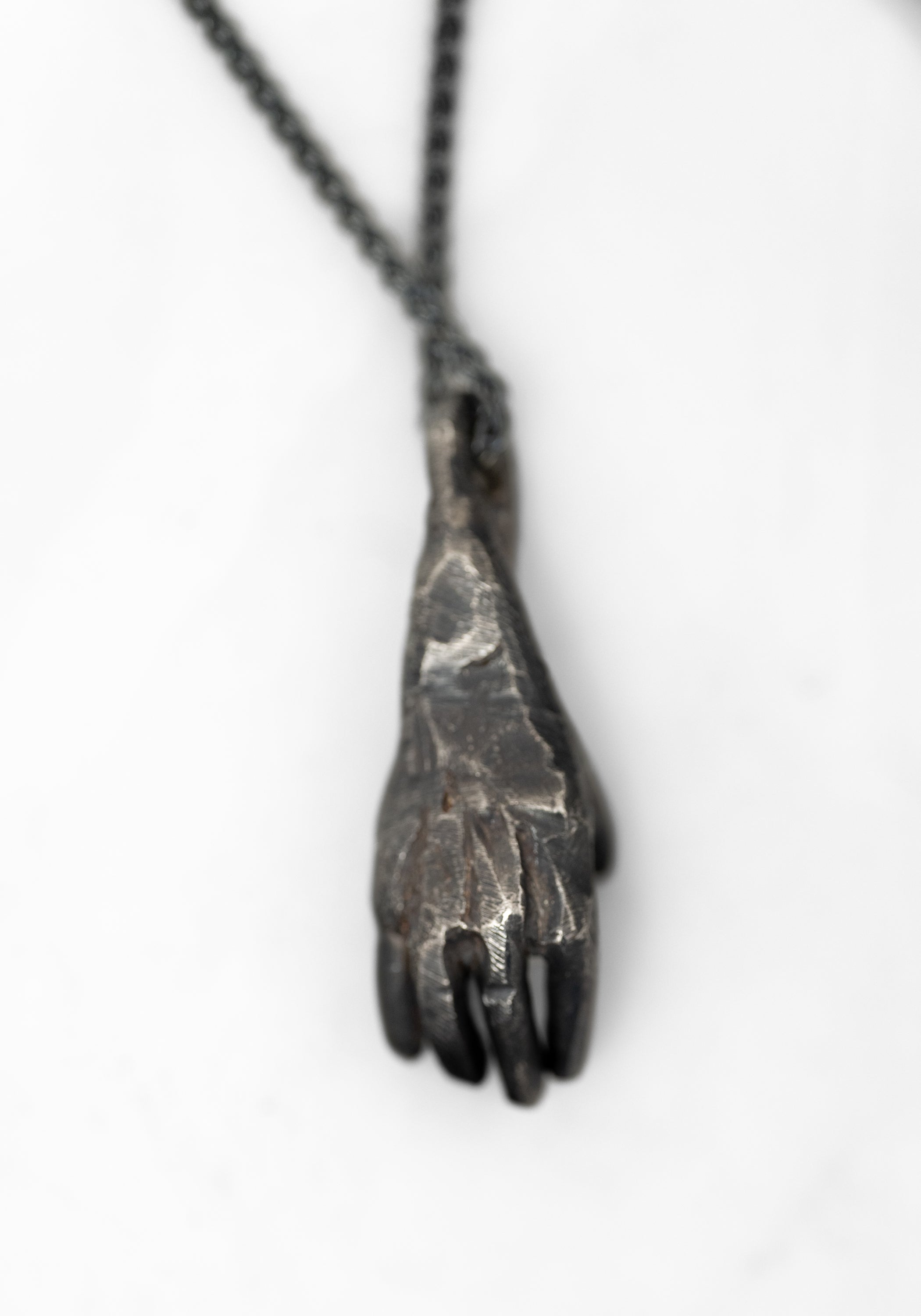 Oxidized Sterling Hand Holding Triangle Amethyst Necklace - December Thieves